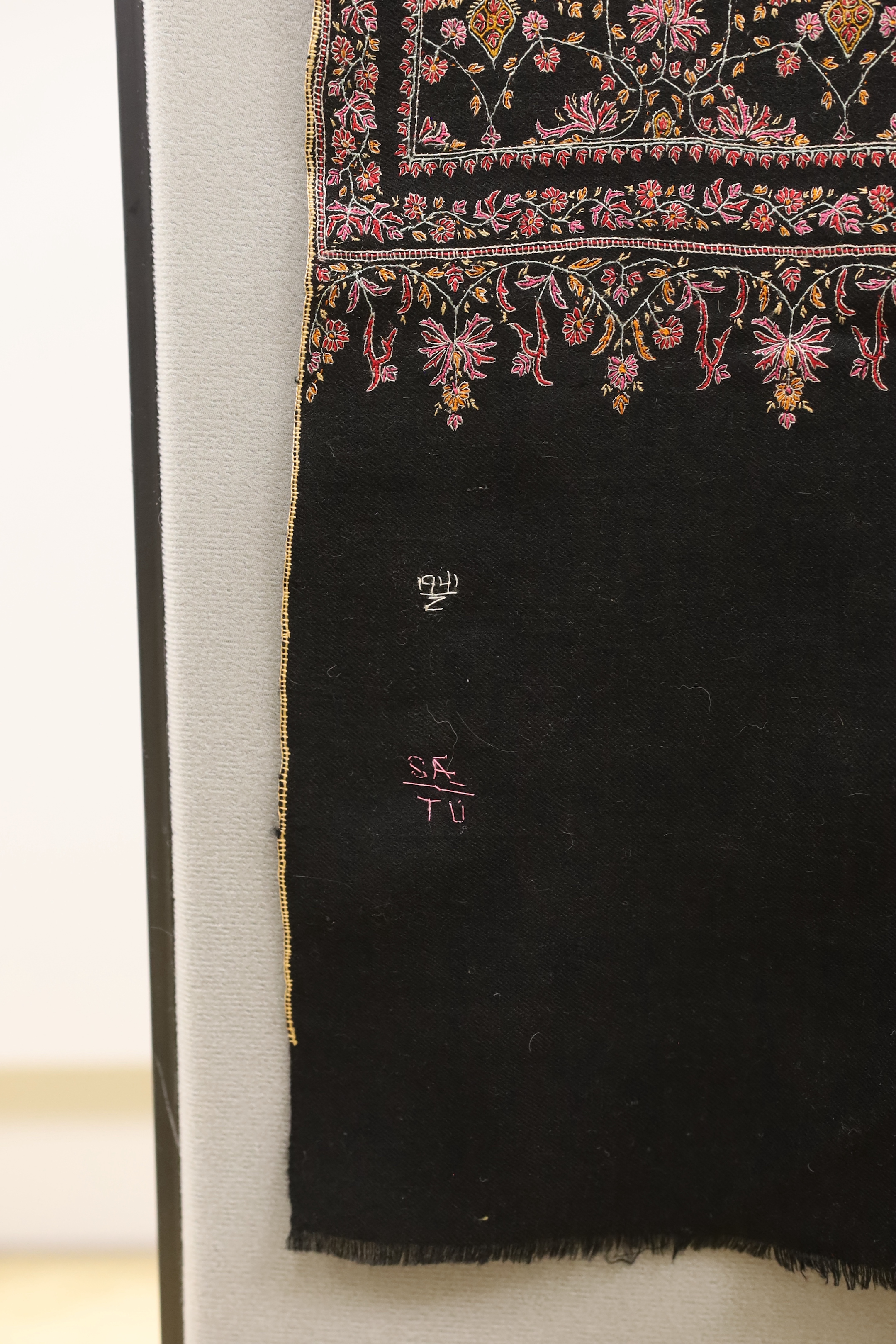 A very finely hand embroidered multicoloured silk black cashmere stole, with embroidered signature and number, 198cm long x 95cm wide